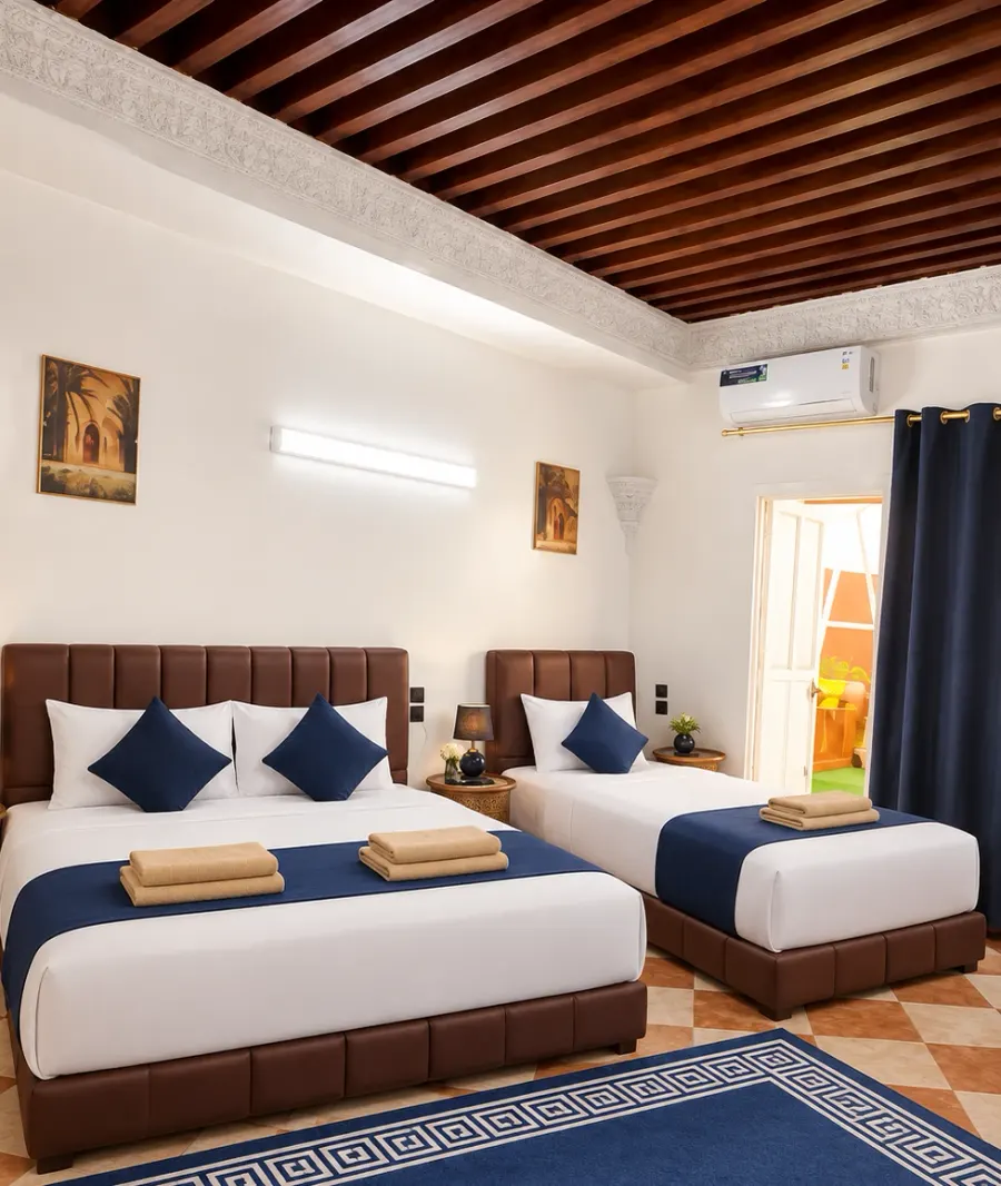 Room with a wooden ceiling, carved plaster cornice and navy accents