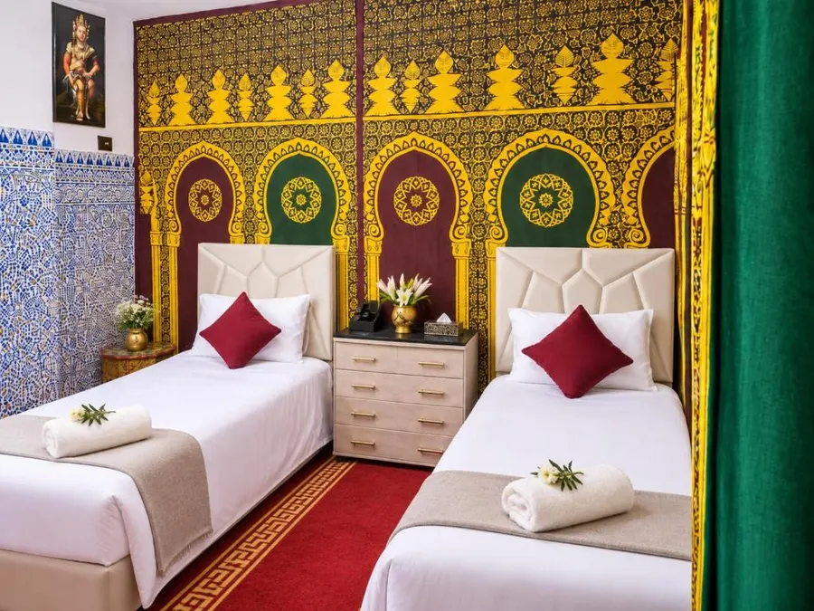 Economy room with gold and green arched wall panels